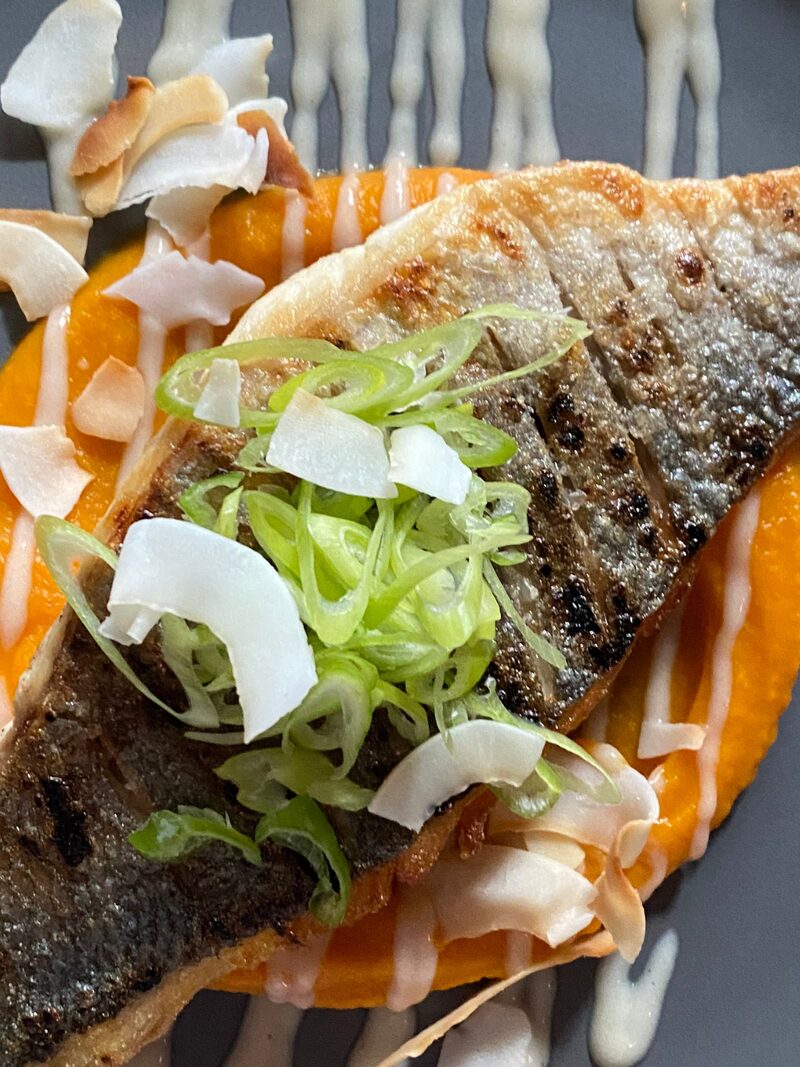 Pan-fried fish with coconut and spring onion